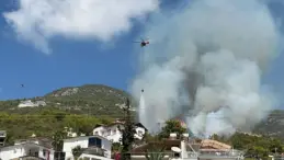 Alanya’da yerleşim yerlerine yakın ormanlık alanda çıkan yangına müdahale ediliyor